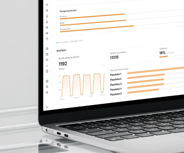 The system's admin dashboard on a MacBook Air